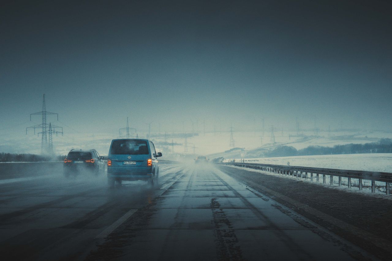vehicles on a misty highway at twilight creating an atmospheric and ci