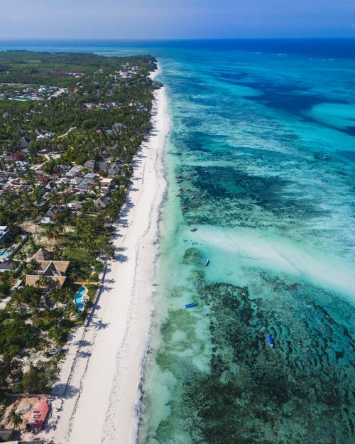 Free Stunning aerial view of Zanzibar's pristine coastline and turquoise ocean. Stock Photo