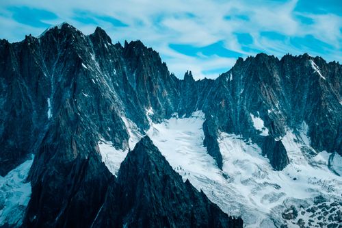 Free Stunning aerial view of snowy mountain peaks in Haute-Savoie, France during winter. Stock Photo