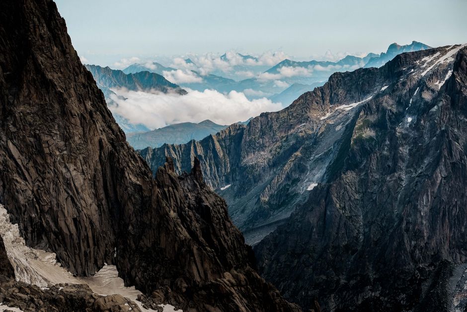 Stunning view of rugged mountain peaks and clouds in Haute-Savoie, France.