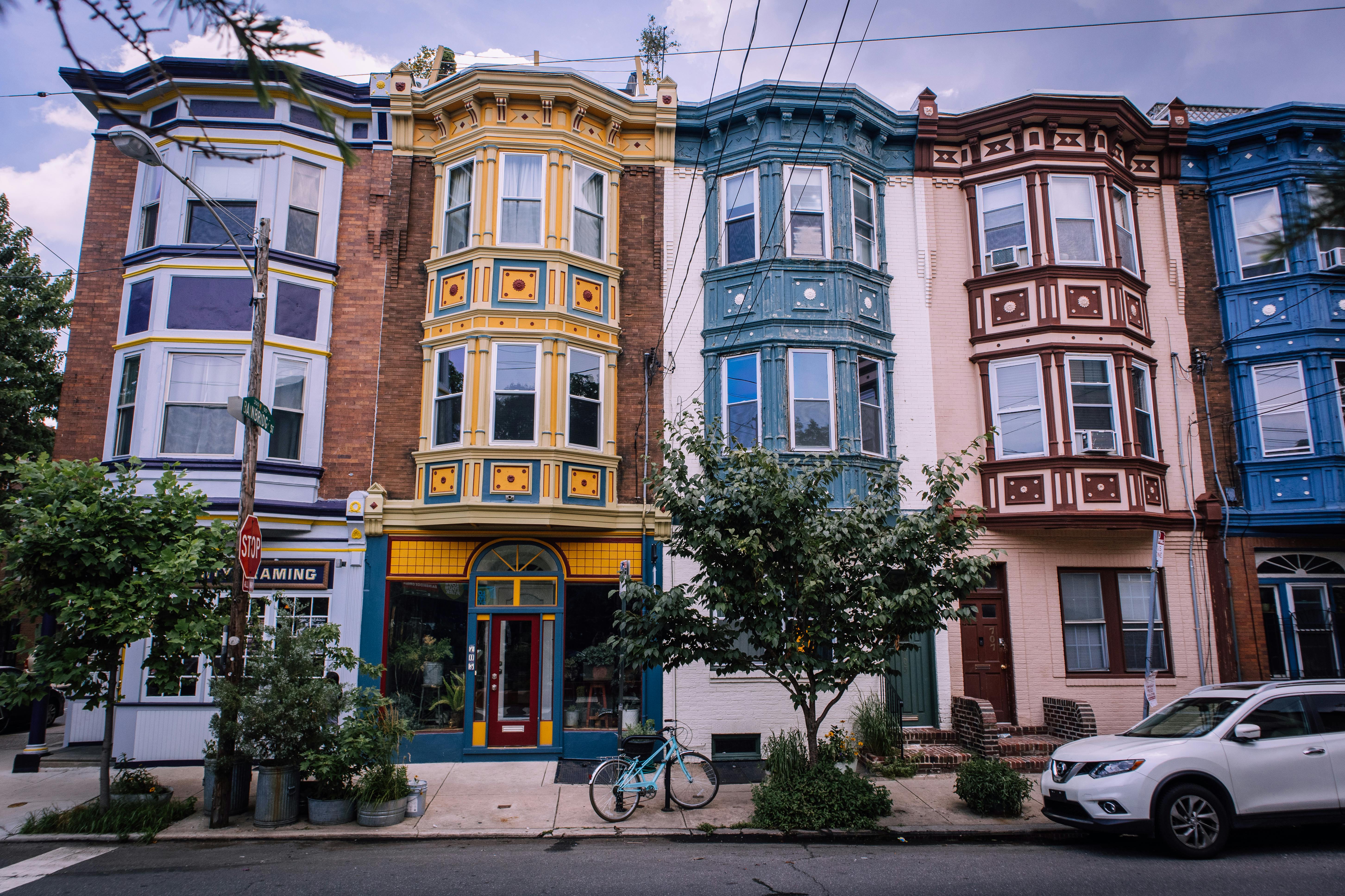 Vibrant Victorian-style row houses in Washington, showcasing colorful architectural details.