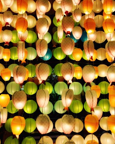 Paper lanterns glowing at a night festival — photo by David Lund on Pexels