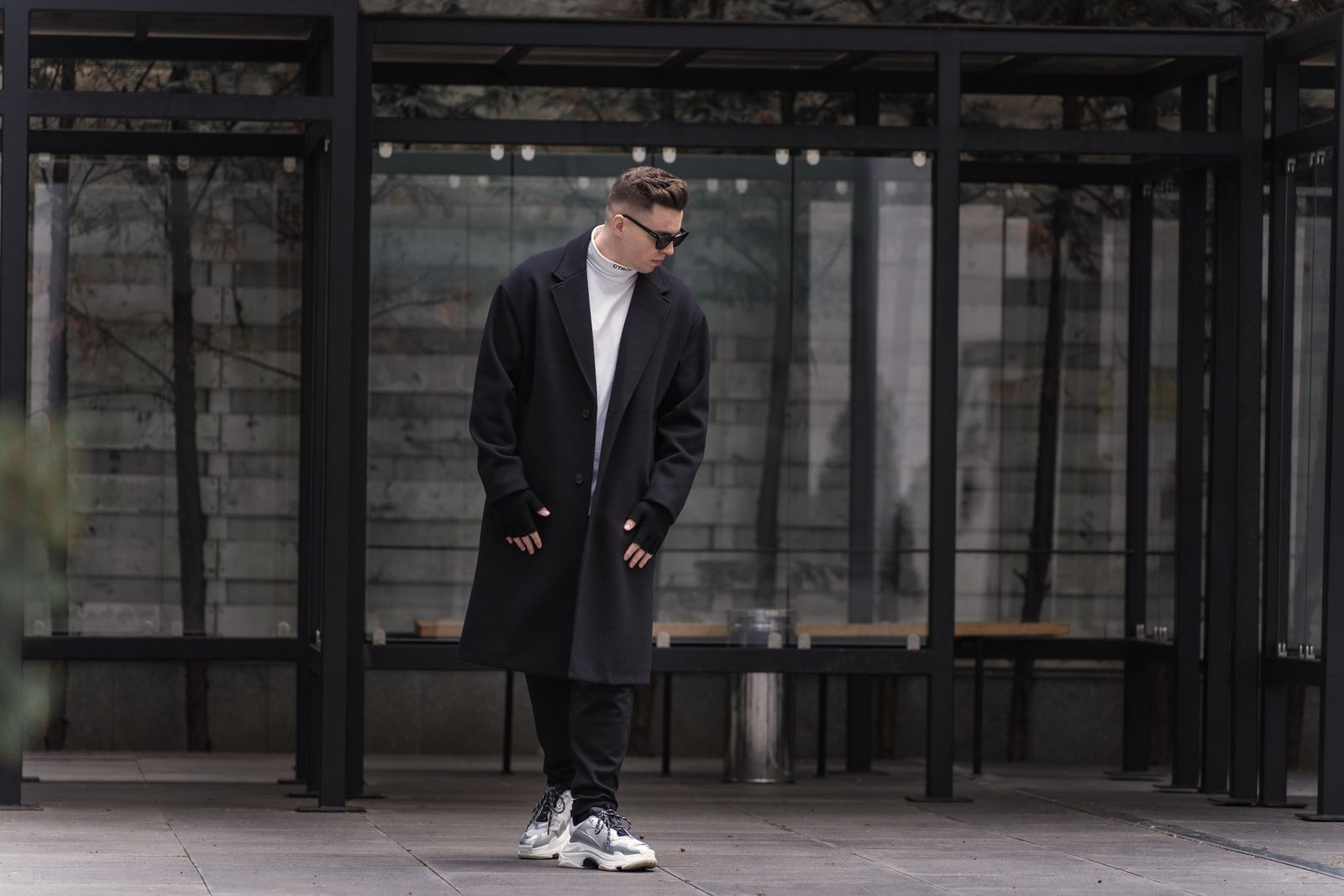 FIRST CULTURE streetwear — model in baggy track pants