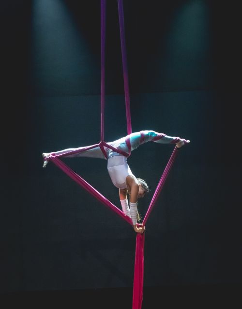 Free Graceful aerial performer demonstrating acrobatic skills in a theatrical setting in Brazil. Stock Photo