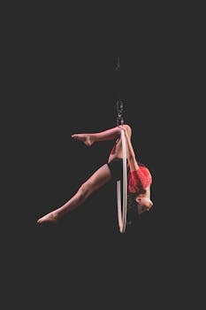 A dancer performing an aerial hoop routine with precision and elegance.