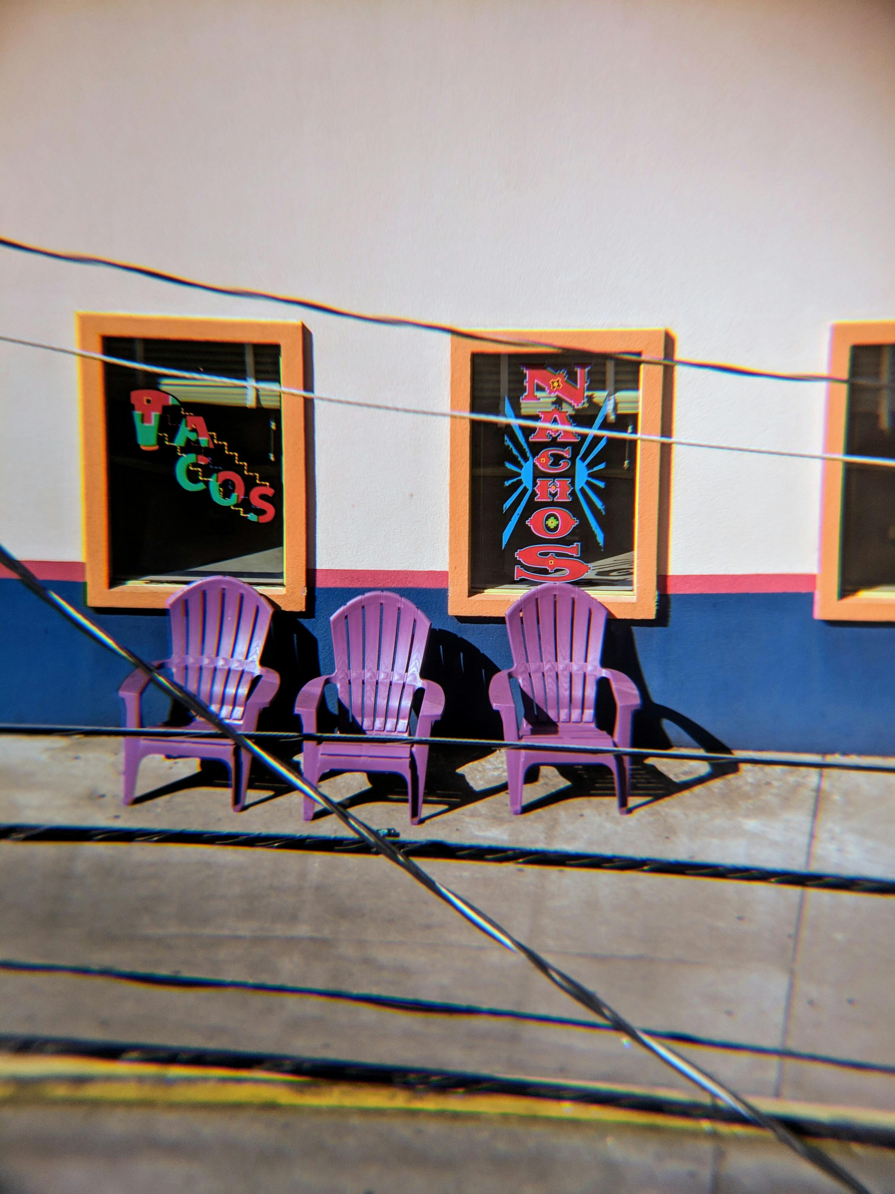 Three Purple Plastic Chairs · Free Stock Photo