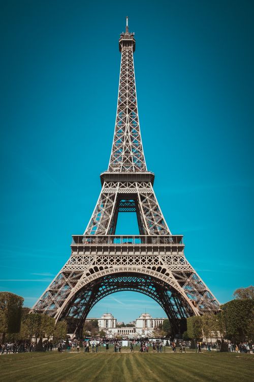 Free Stunning view of Eiffel Tower in Paris against a clear blue sky. Stock Photo