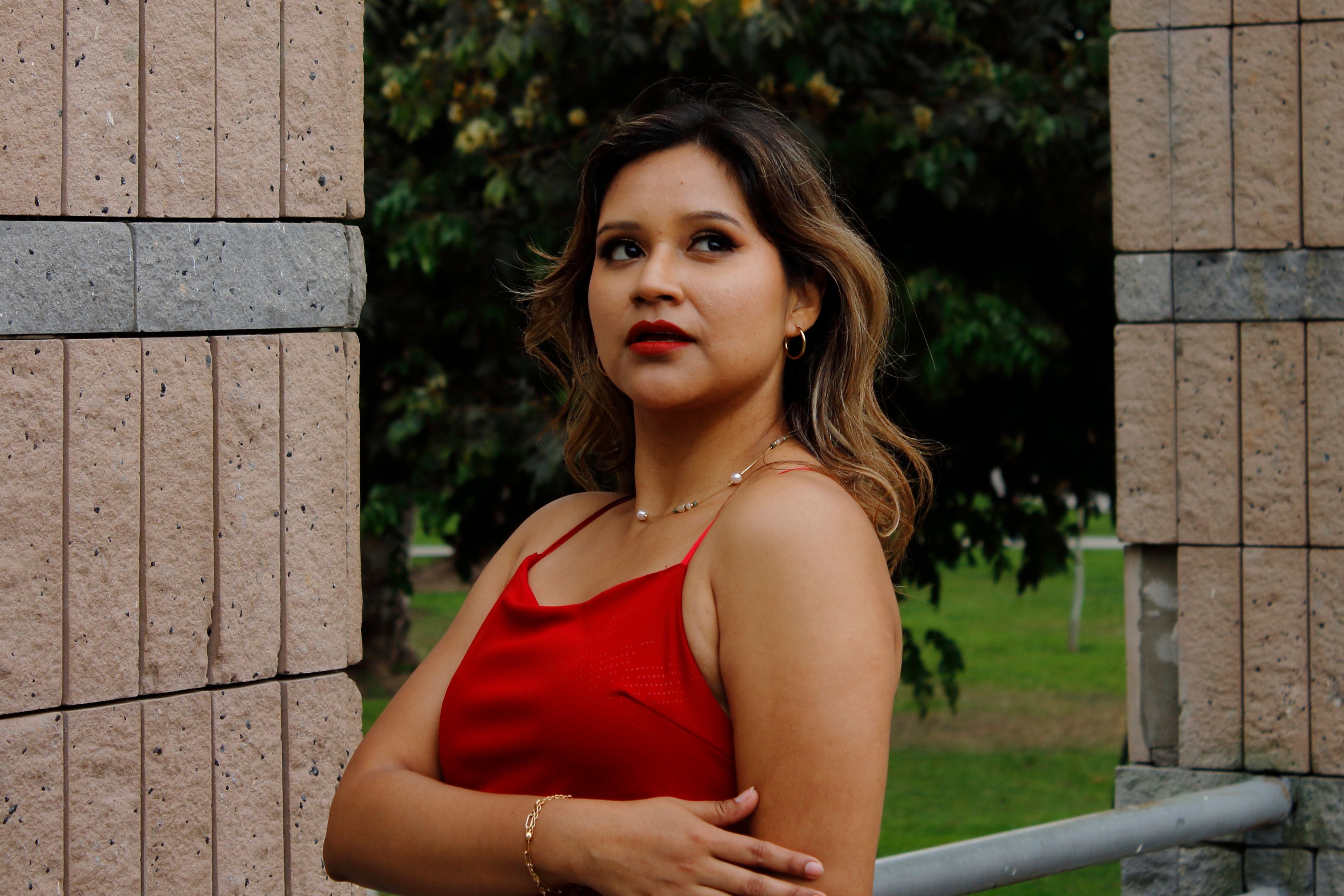 Elegant Brunette Woman in Red Dress Outdoors · Free Stock Photo