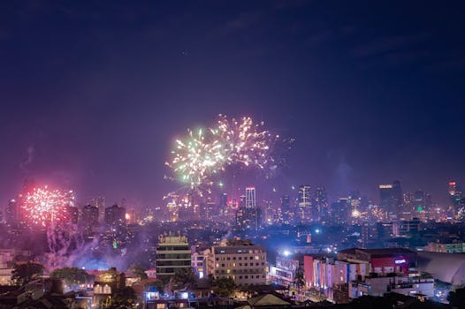Spectacular fireworks light up the Jakarta skyline, showcasing the bustling city's night life and celebrations.