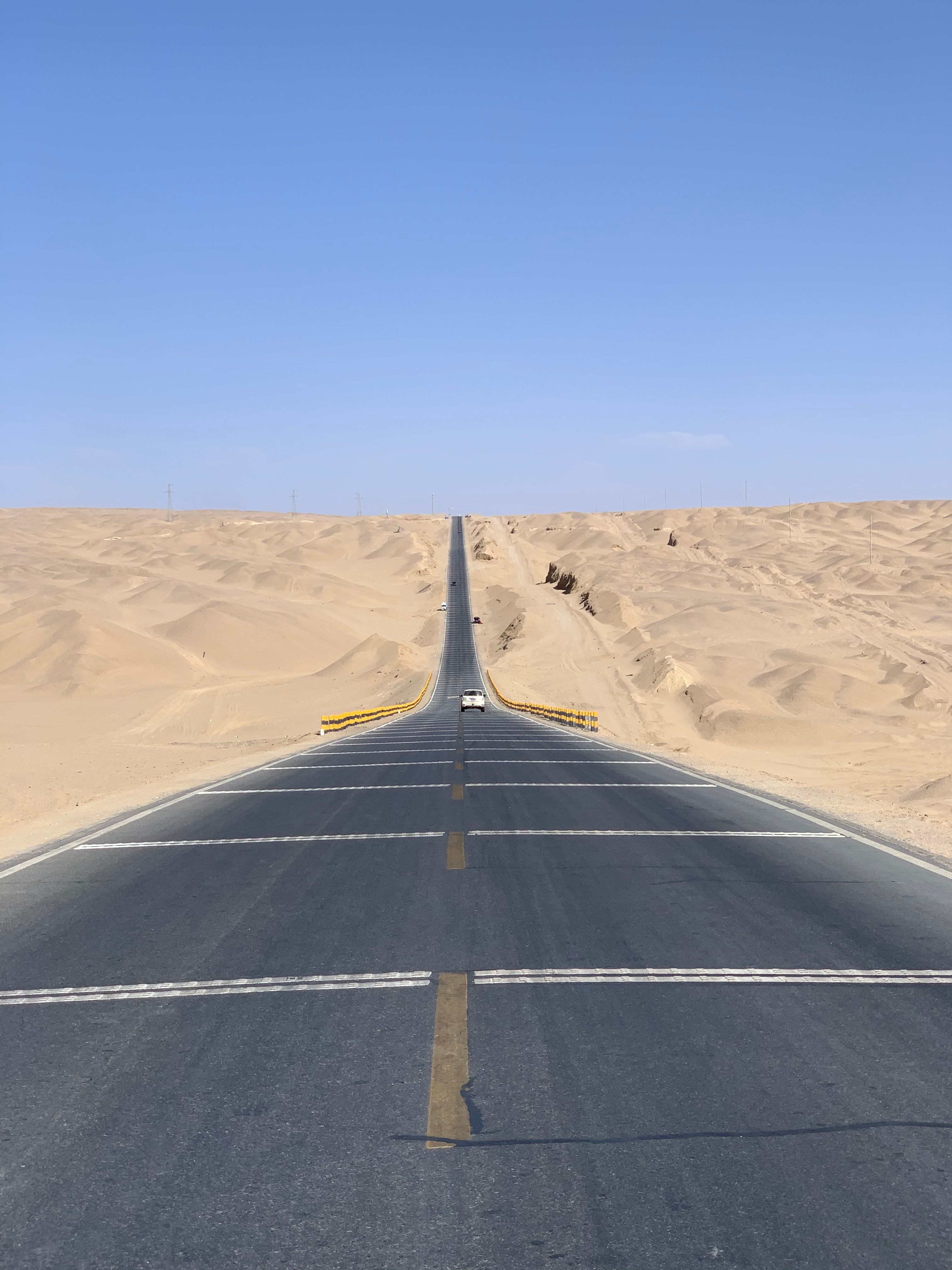 Endless Desert Road Under Clear Blue Sky · Free Stock Photo