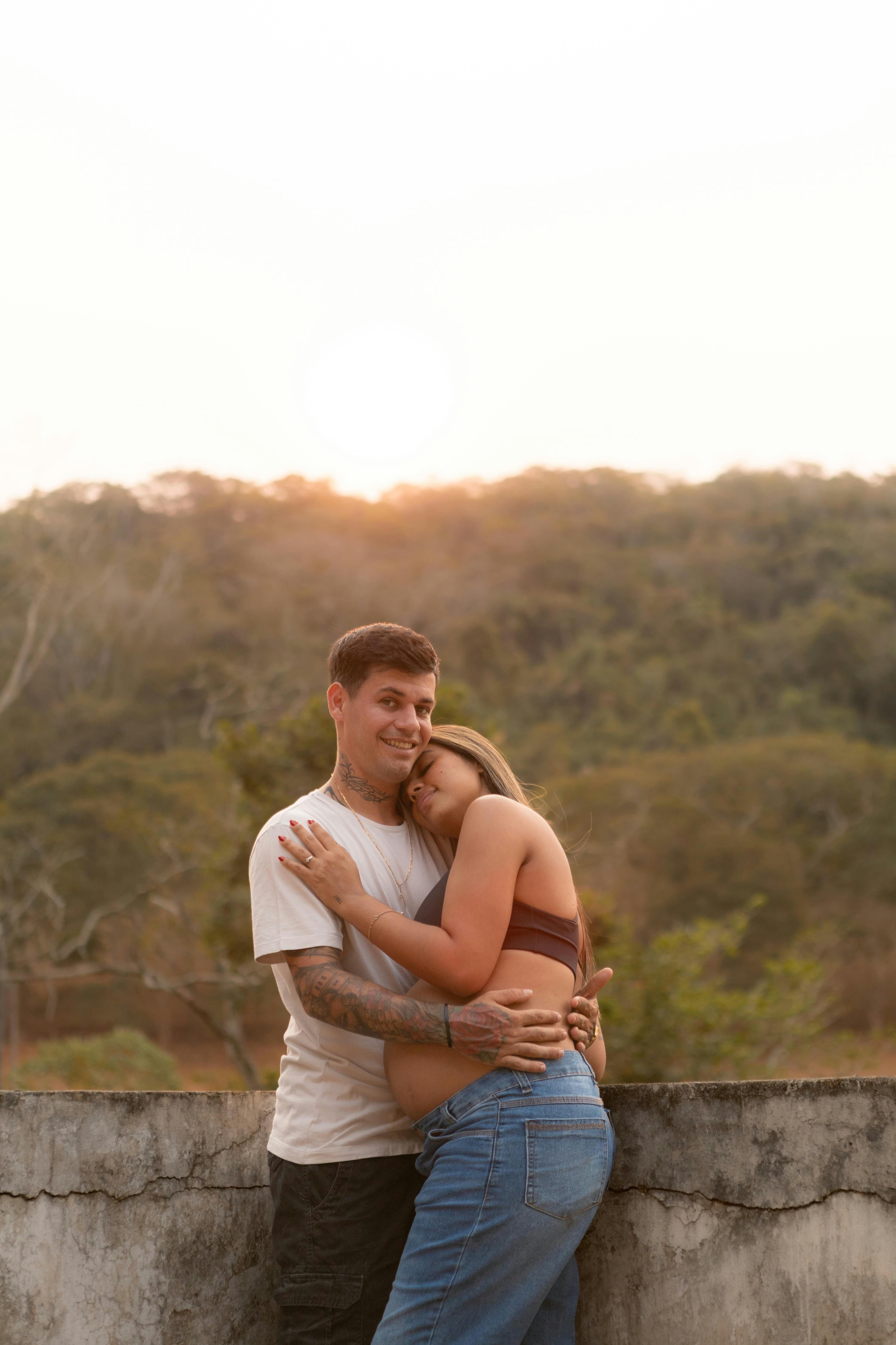 romantic couple embracing at scenic sunset