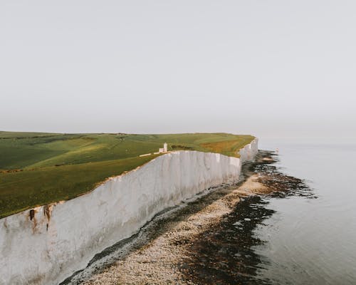 Aerial Photo of Cliff Near Seashore