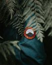 Selective Photography of a Mountain Expedition Team Badge