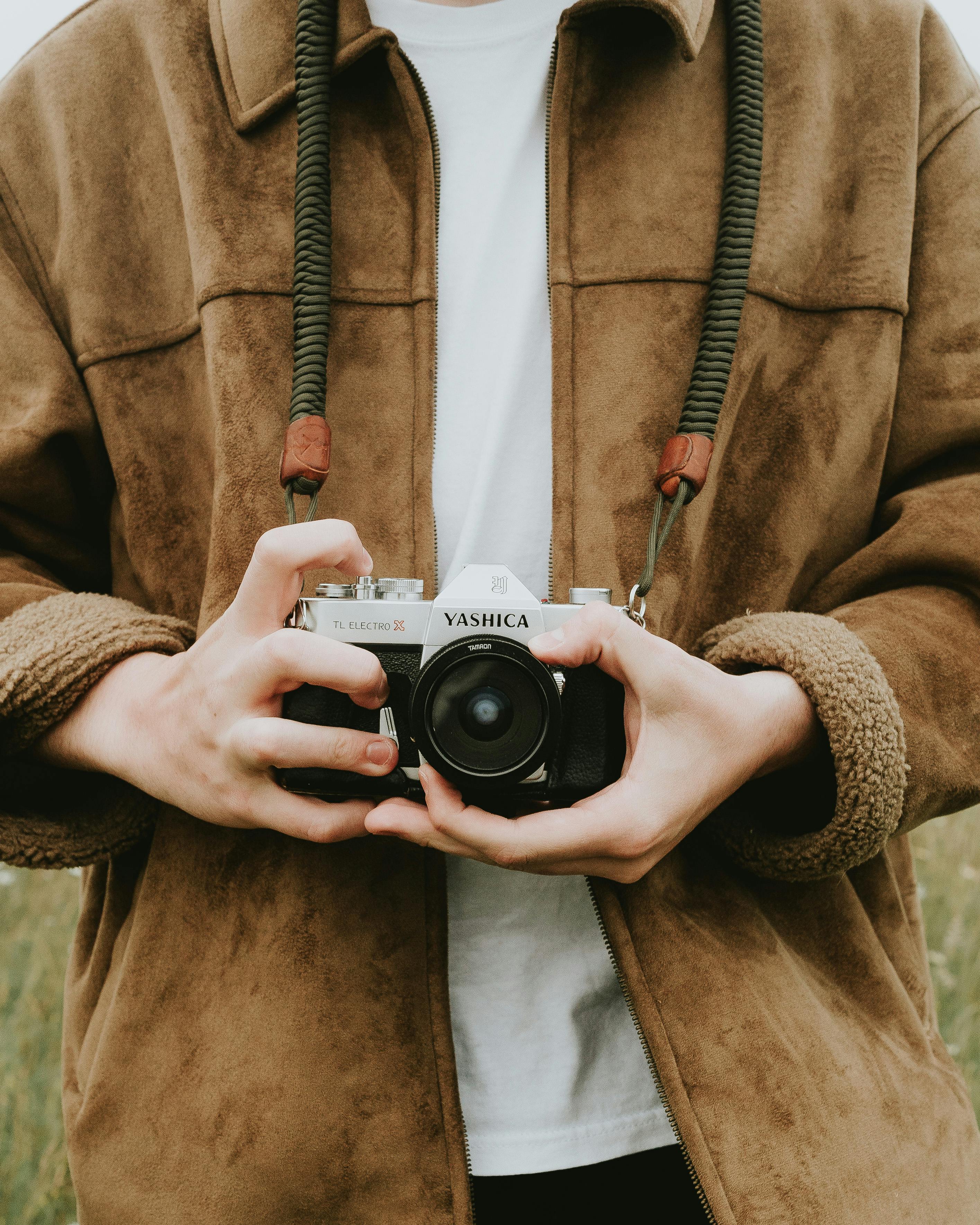 photo of person holding camera