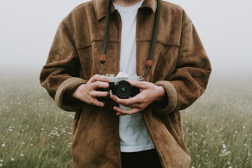 Photo Of Person Holding Camera
