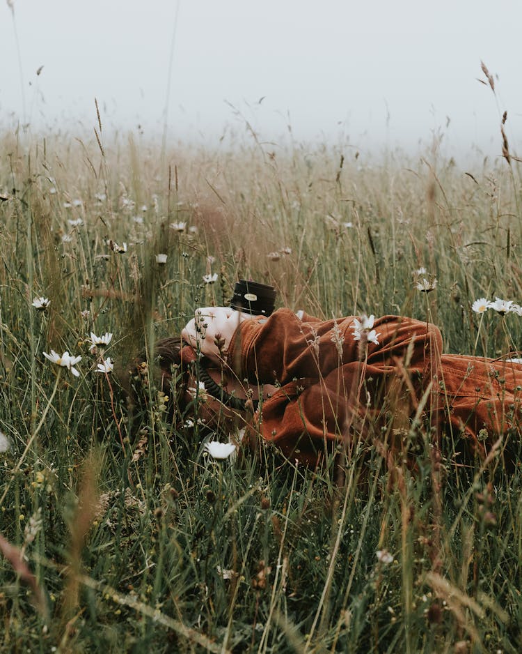 Person Lying Down On Grass