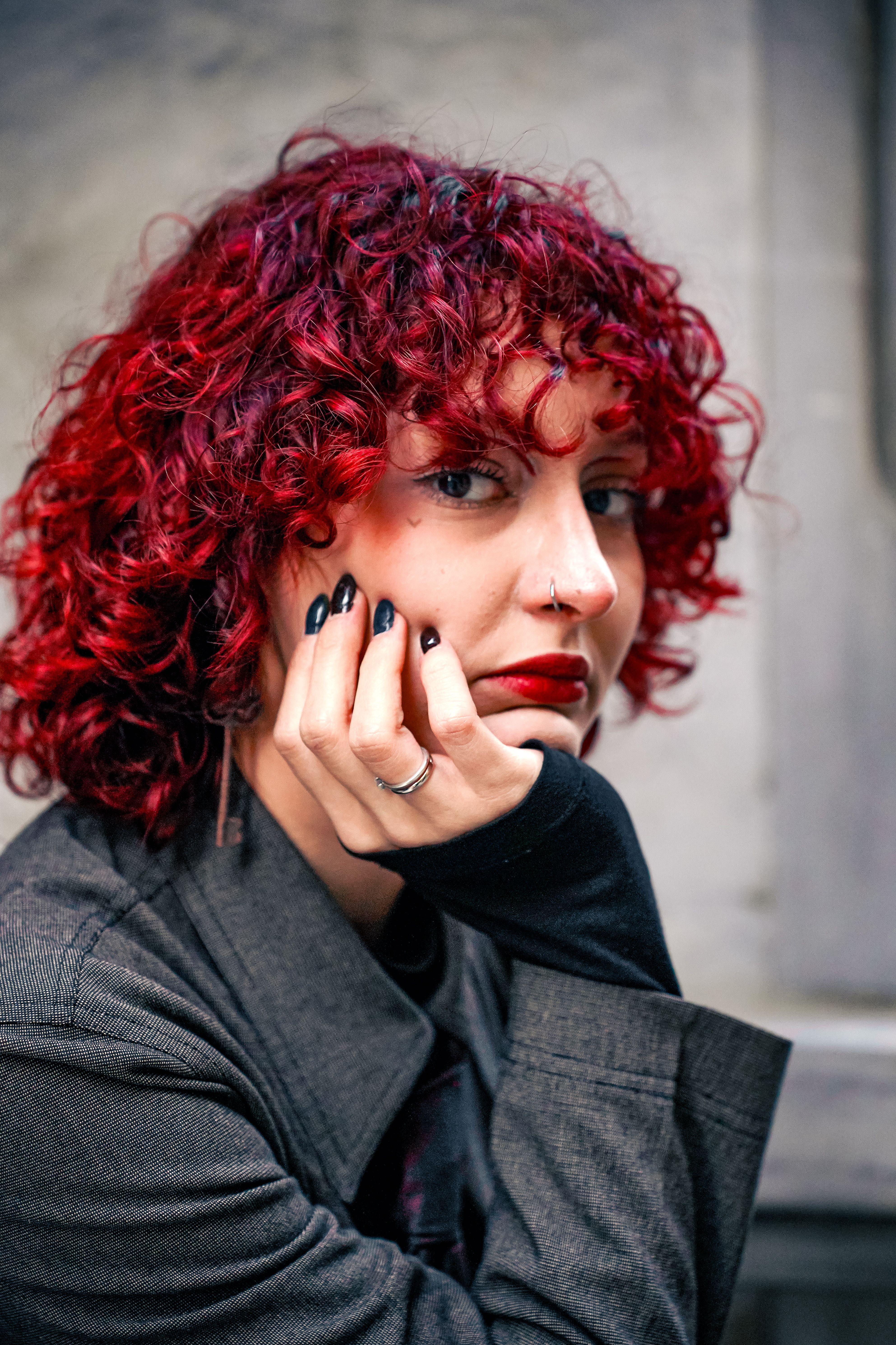 Portrait of a Woman with Curly Red Hair · Free Stock Photo