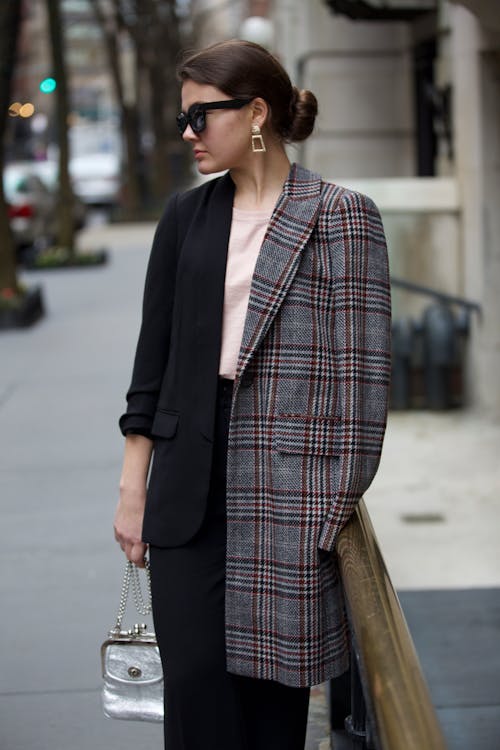 Woman Wearing Gray and White Plaid Coat