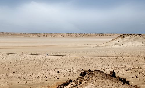 Free Expansive view of Dakhla desert landscape with a clear sky and rugged terrain. Stock Photo