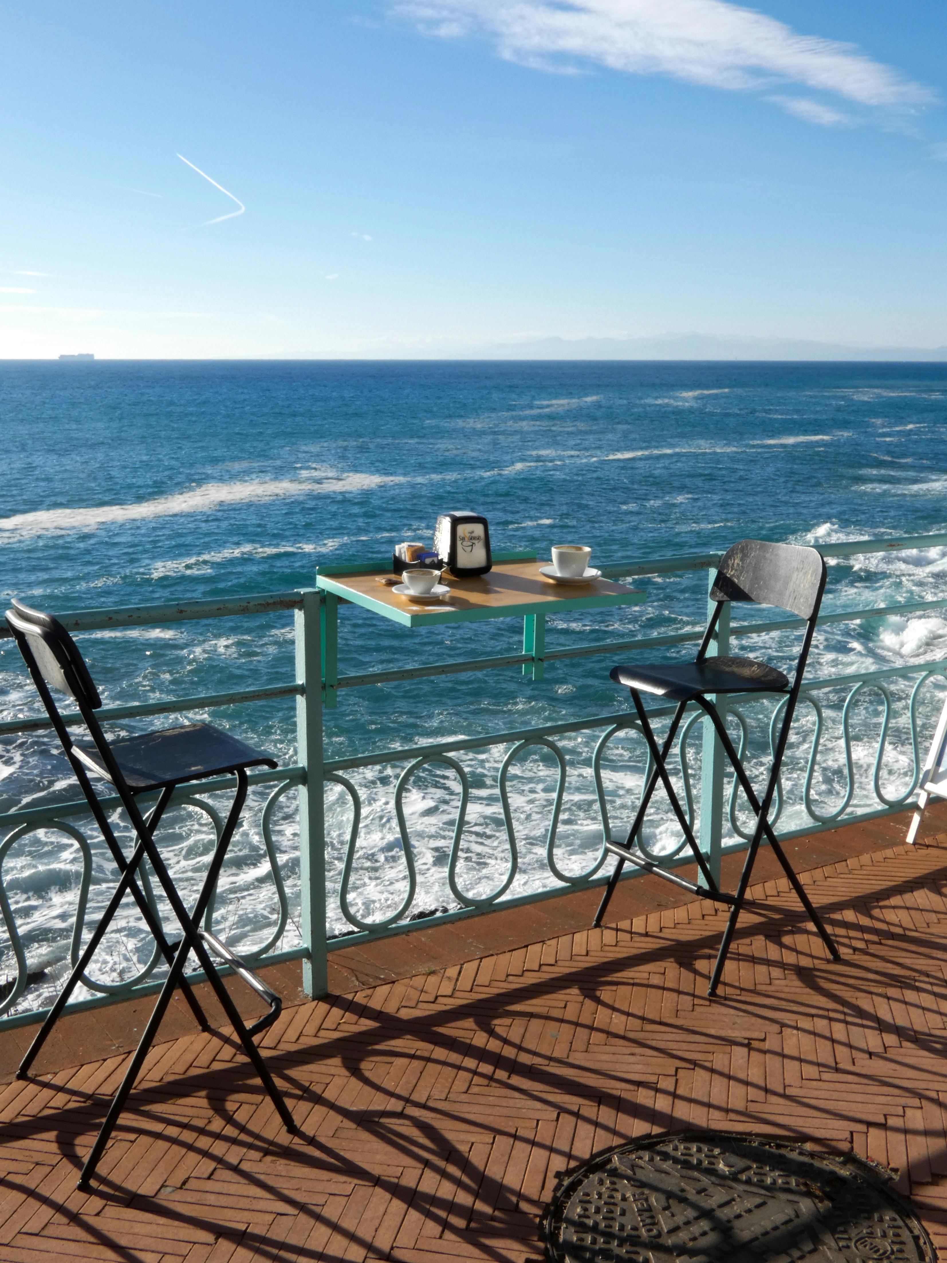 Sunny day at a seaside café with a beautiful ocean view in Genova, Liguria.