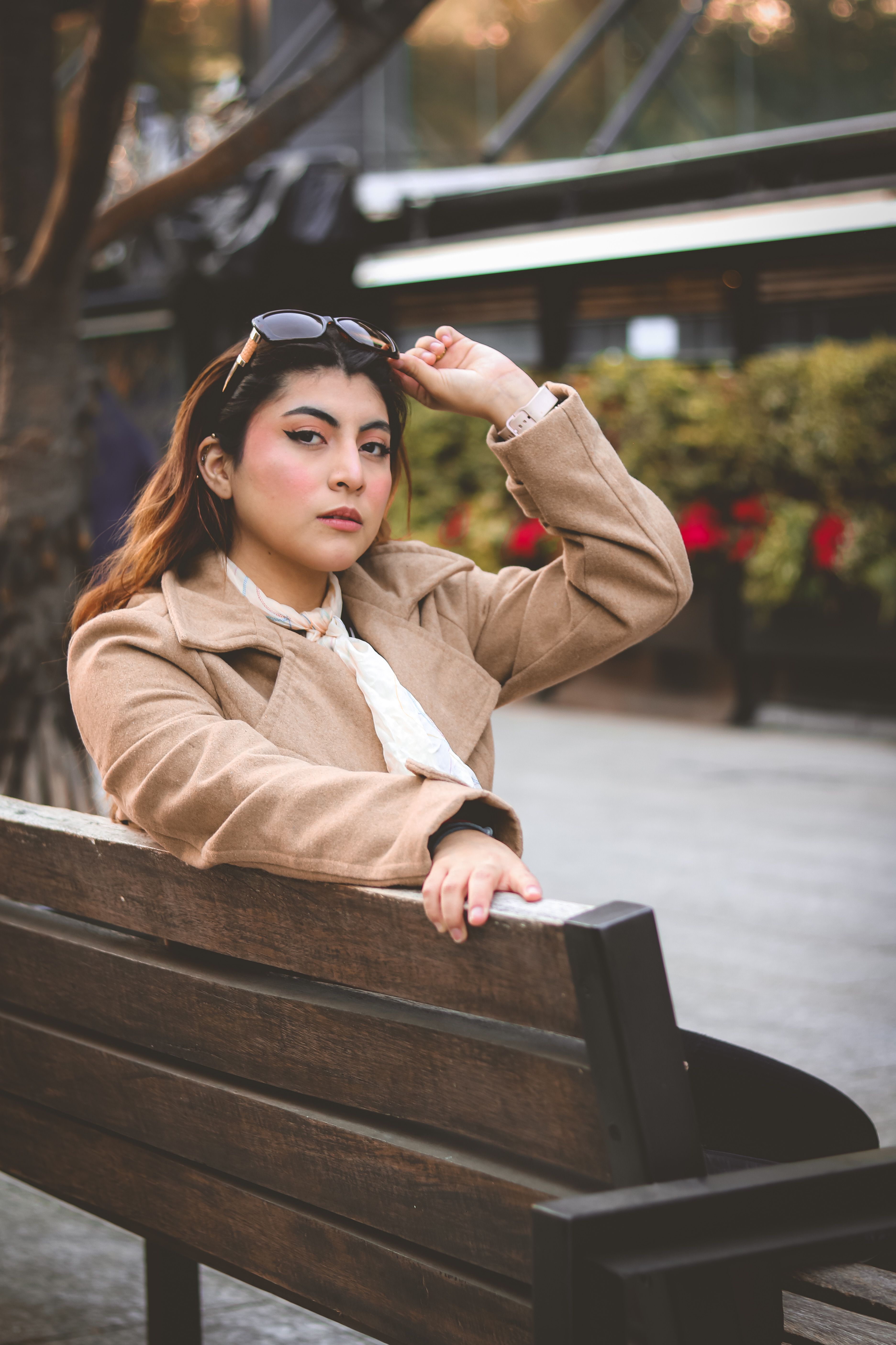 Stylish Woman Relaxing on Park Bench Outdoors · Free Stock Photo