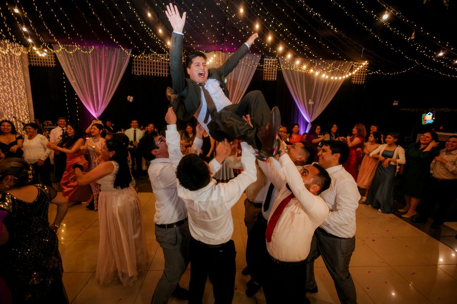 wedding reception guests having fun karaoke singing