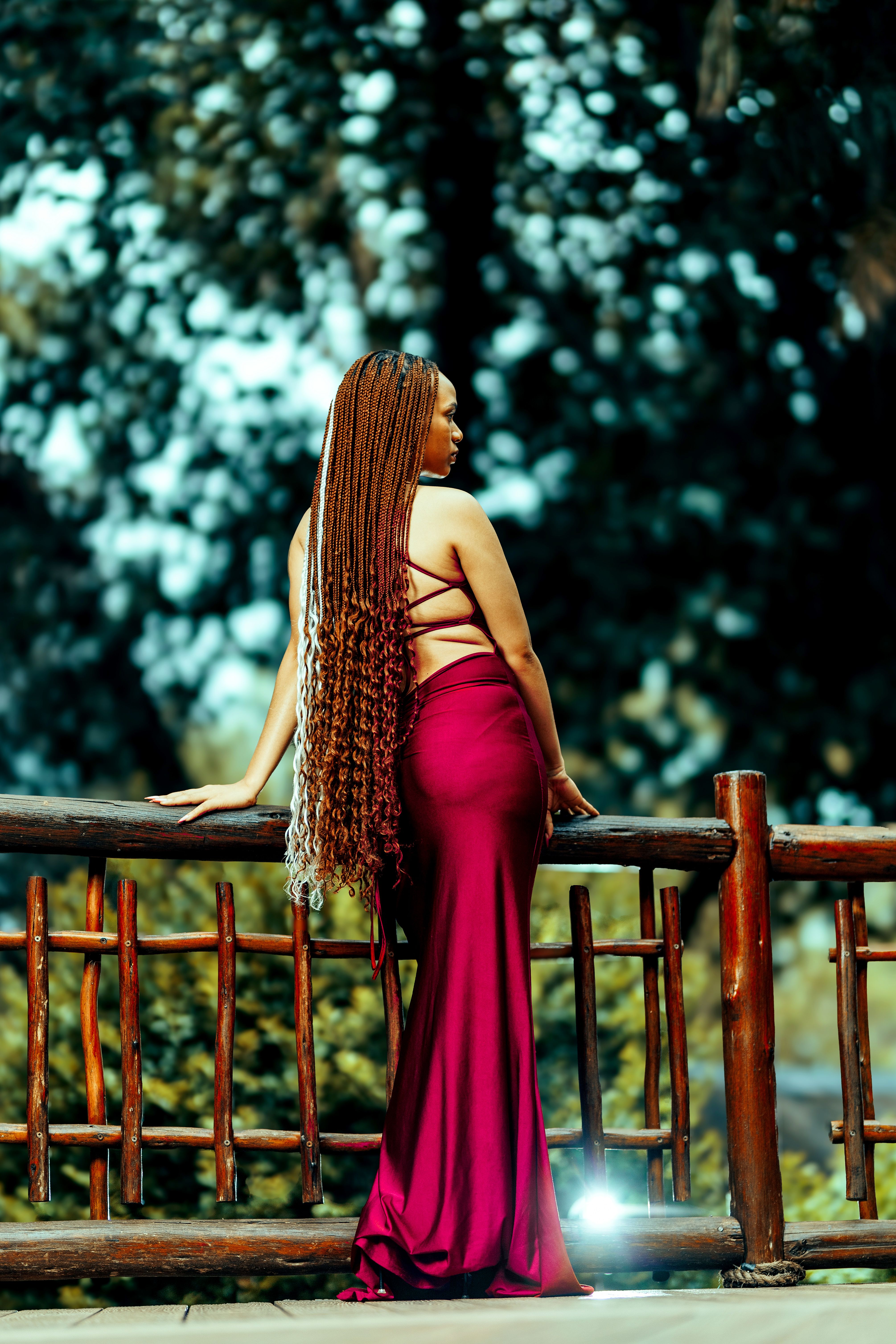 Elegant Woman in Red Dress Posing Outdoors · Free Stock Photo