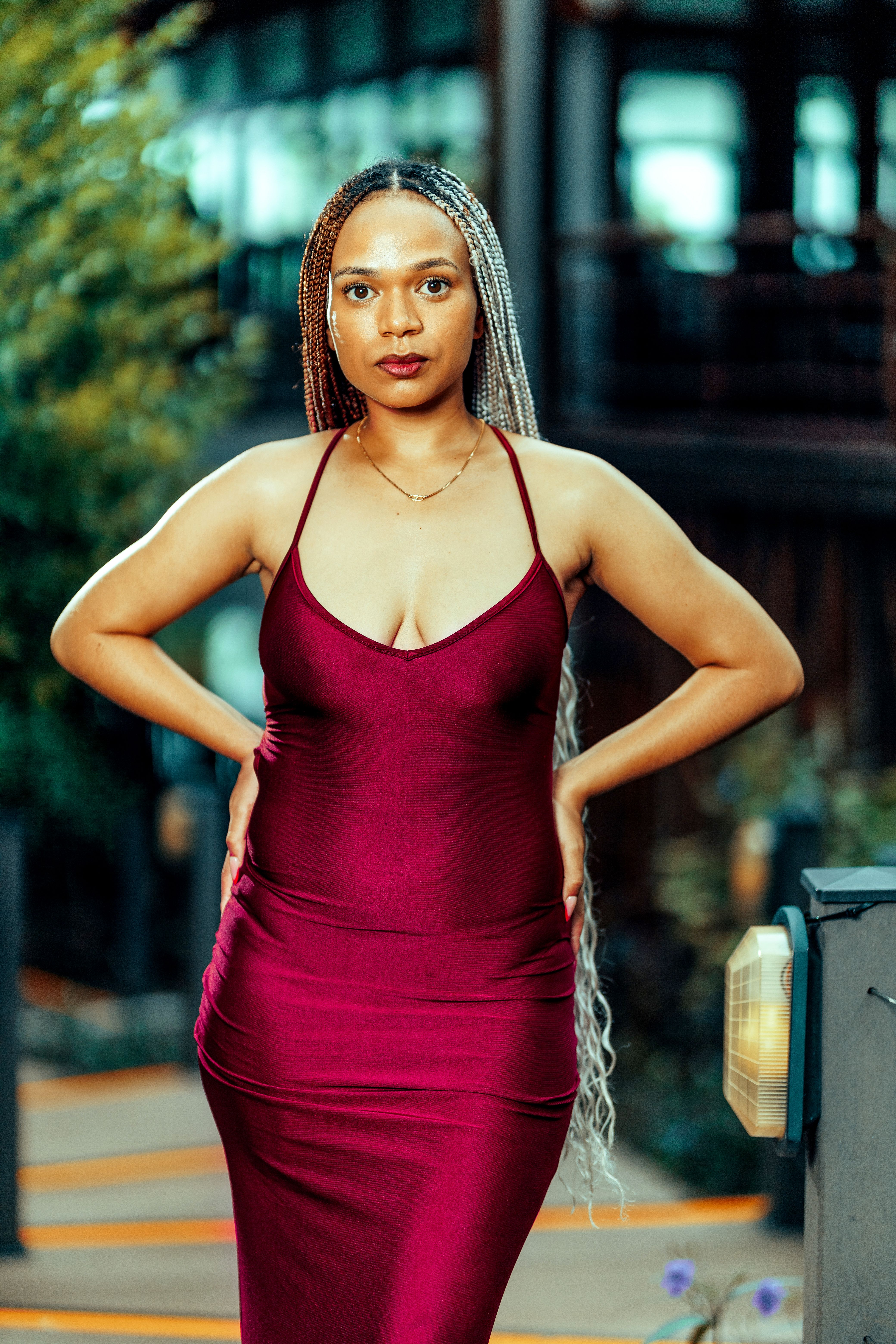 Elegant Woman Posing in Red Dress Outdoors · Free Stock Photo