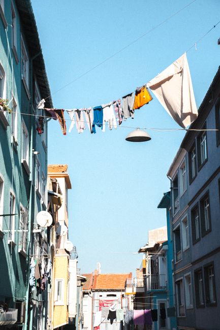 Laundry hangs between colorful buildings in Istanbul's Balat neighborhood.