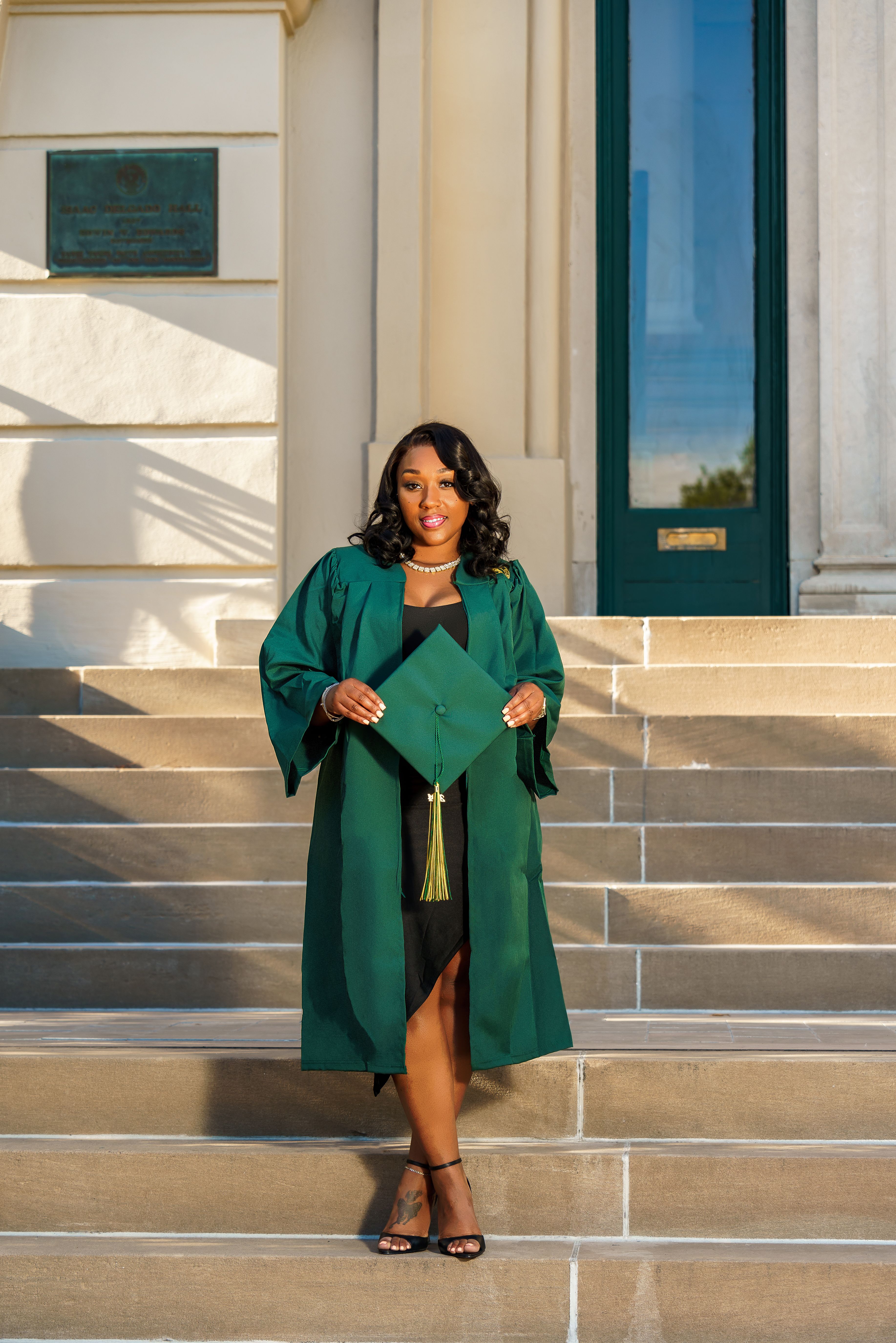 Cheerful Graduate in Cap and Gown Outdoors  Free Stock Photo