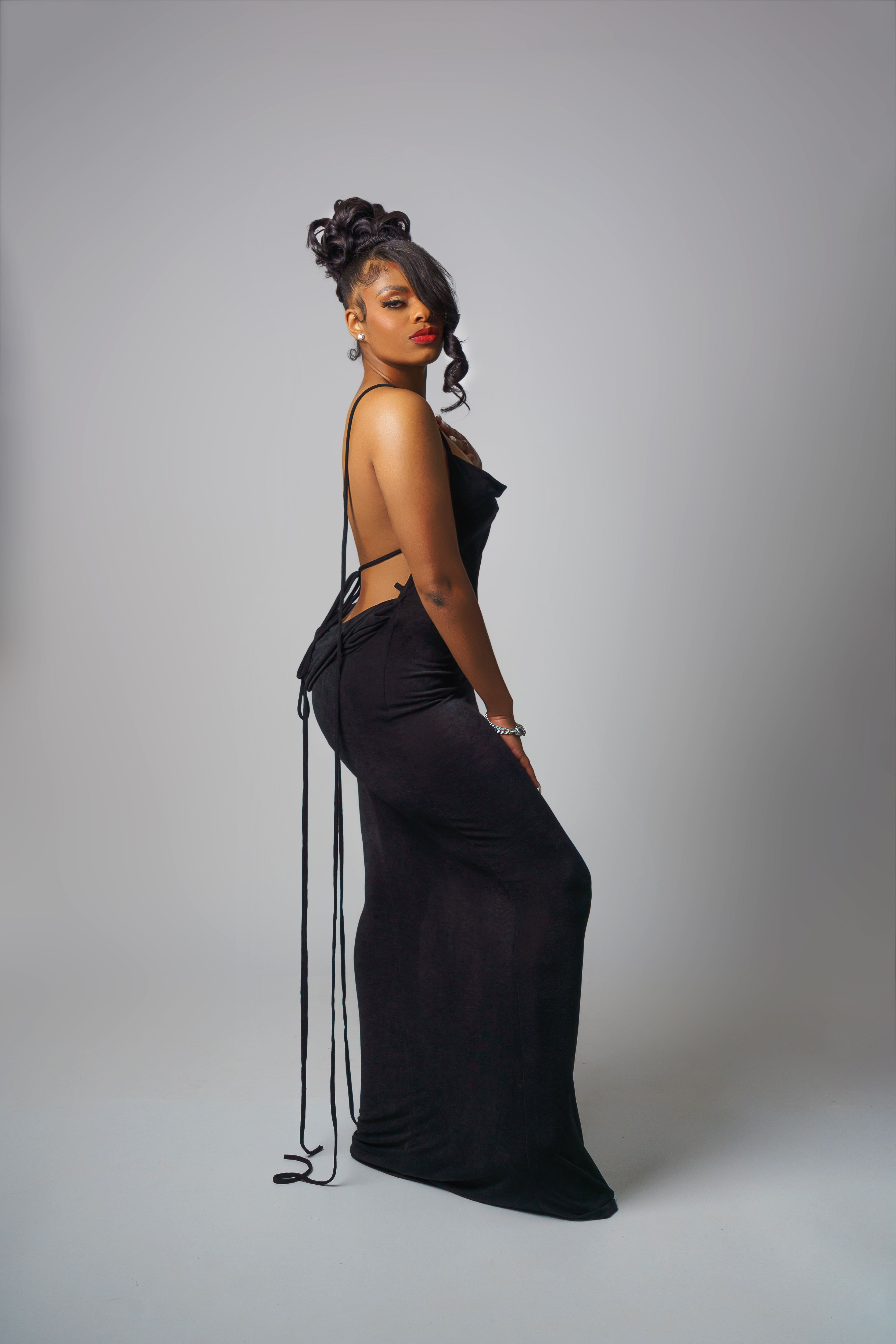 Stylish African American Woman in Elegant Black Dress · Free Stock Photo