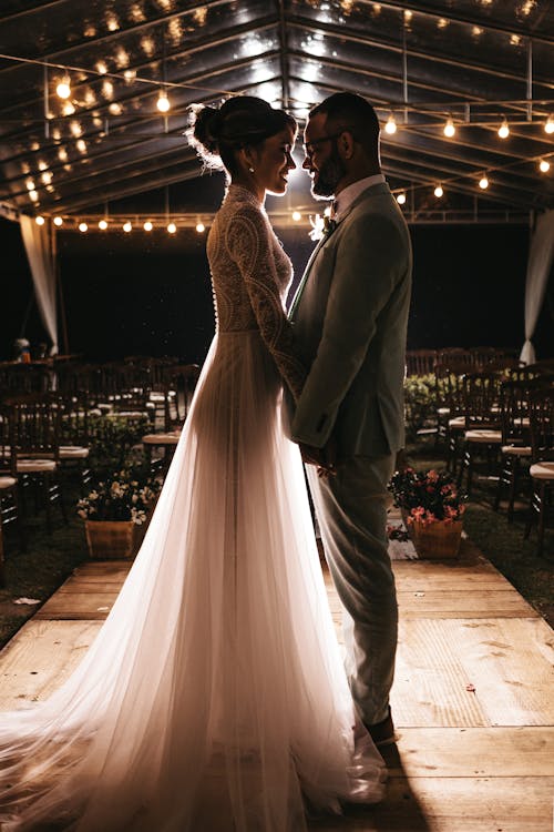 Free Man Standing in Front of Woman in White Wedding Dress Stock Photo