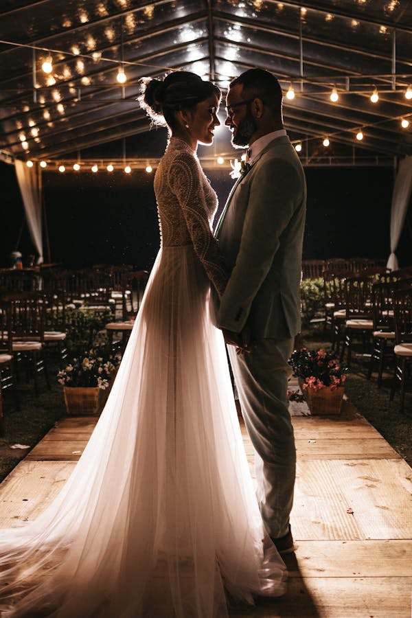 Professional bridal makeup artist applying makeup to bride