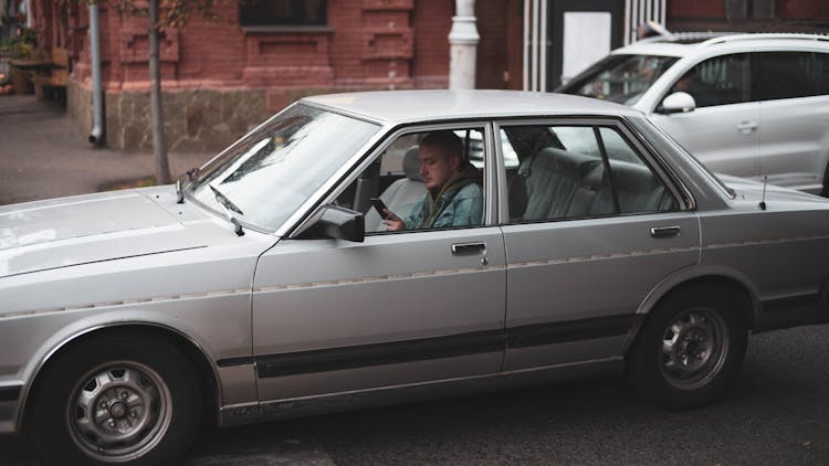 Silver Sedan On Road During Day