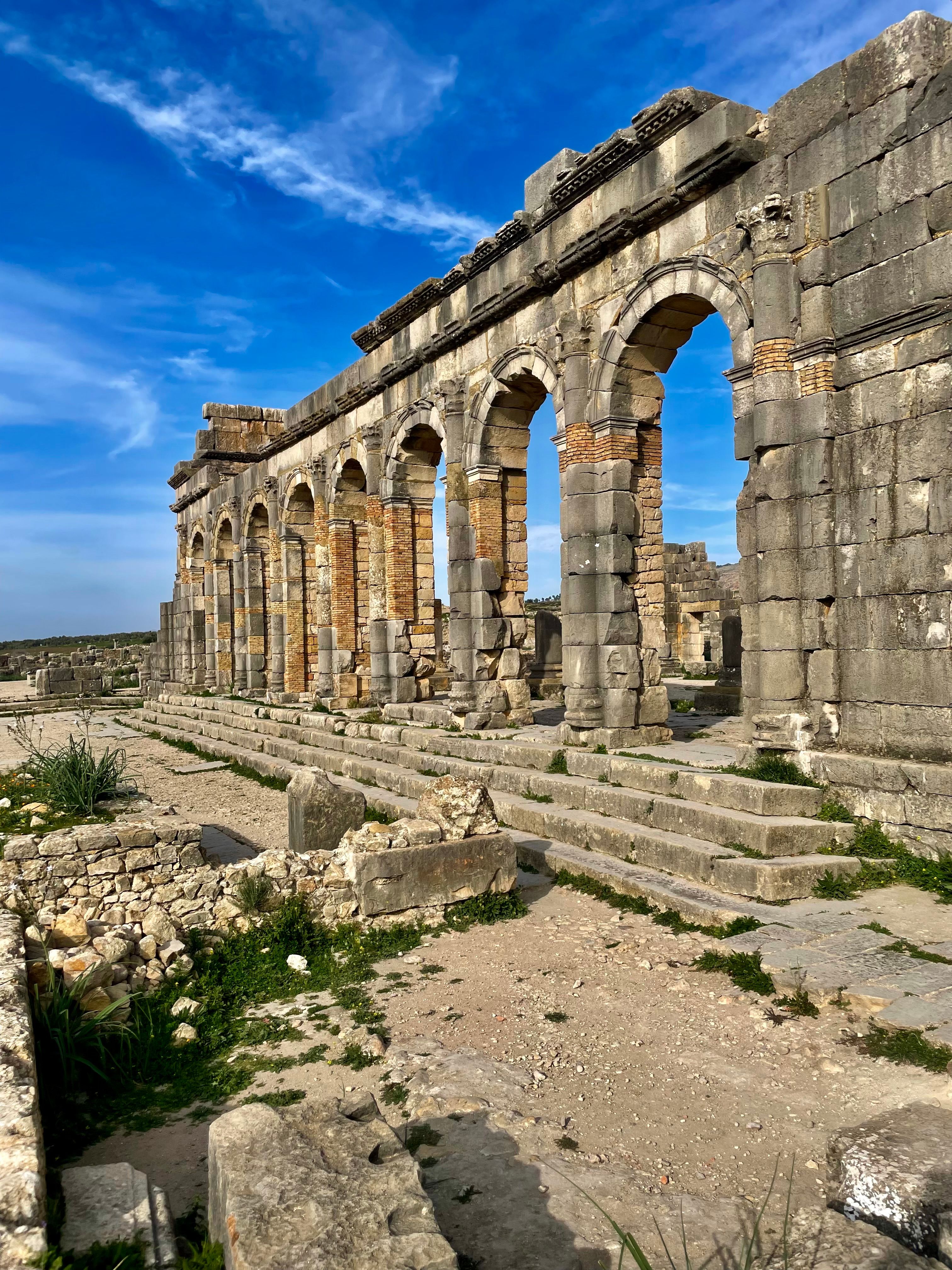 Ancient Roman Ruins Under a Bright Blue Sky · Free Stock Photo