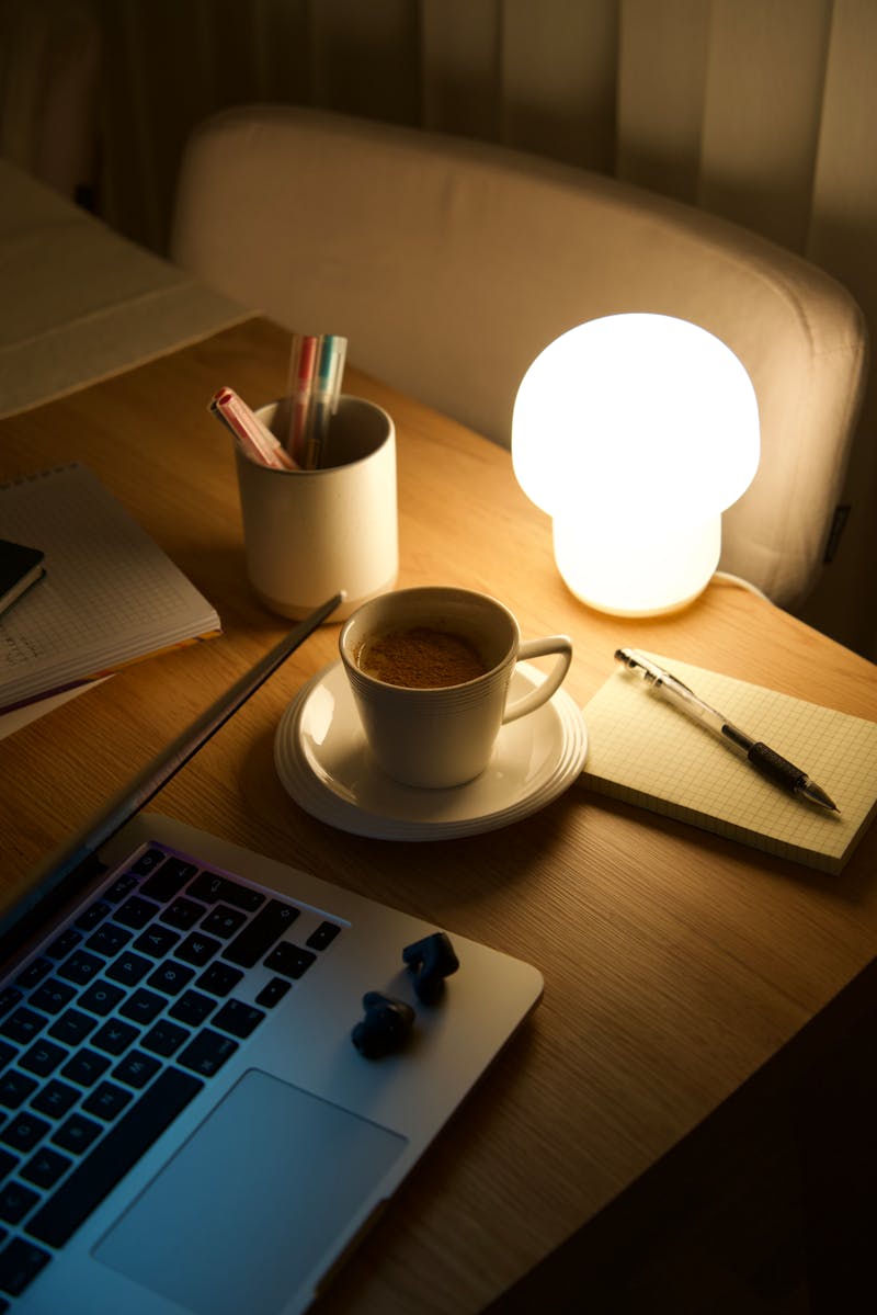 Cozy workspace with coffee and laptop -- the kind of spot that never has an outlet
