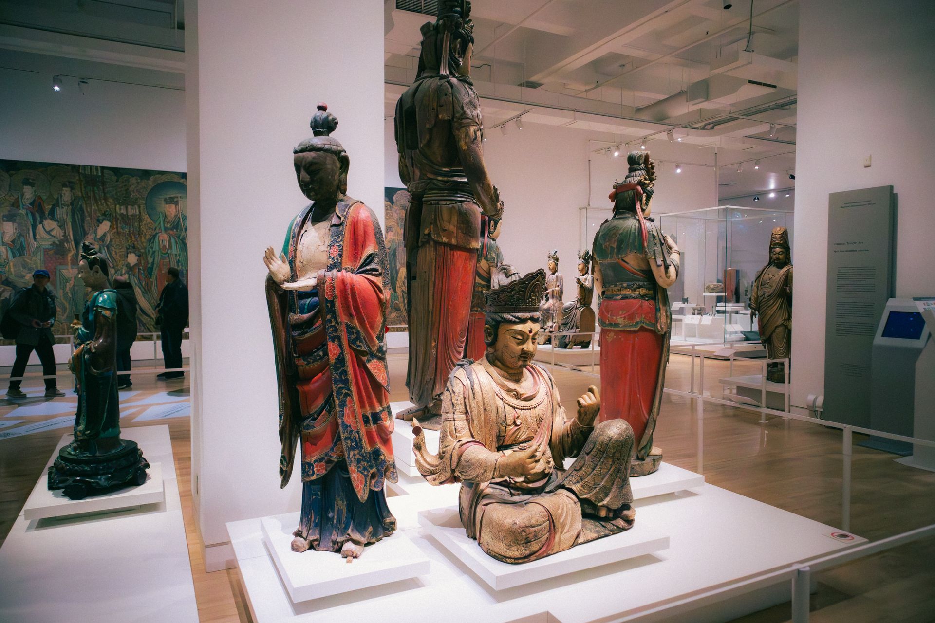 Explore a diverse exhibit of historic Buddhist sculptures at a Toronto art museum.