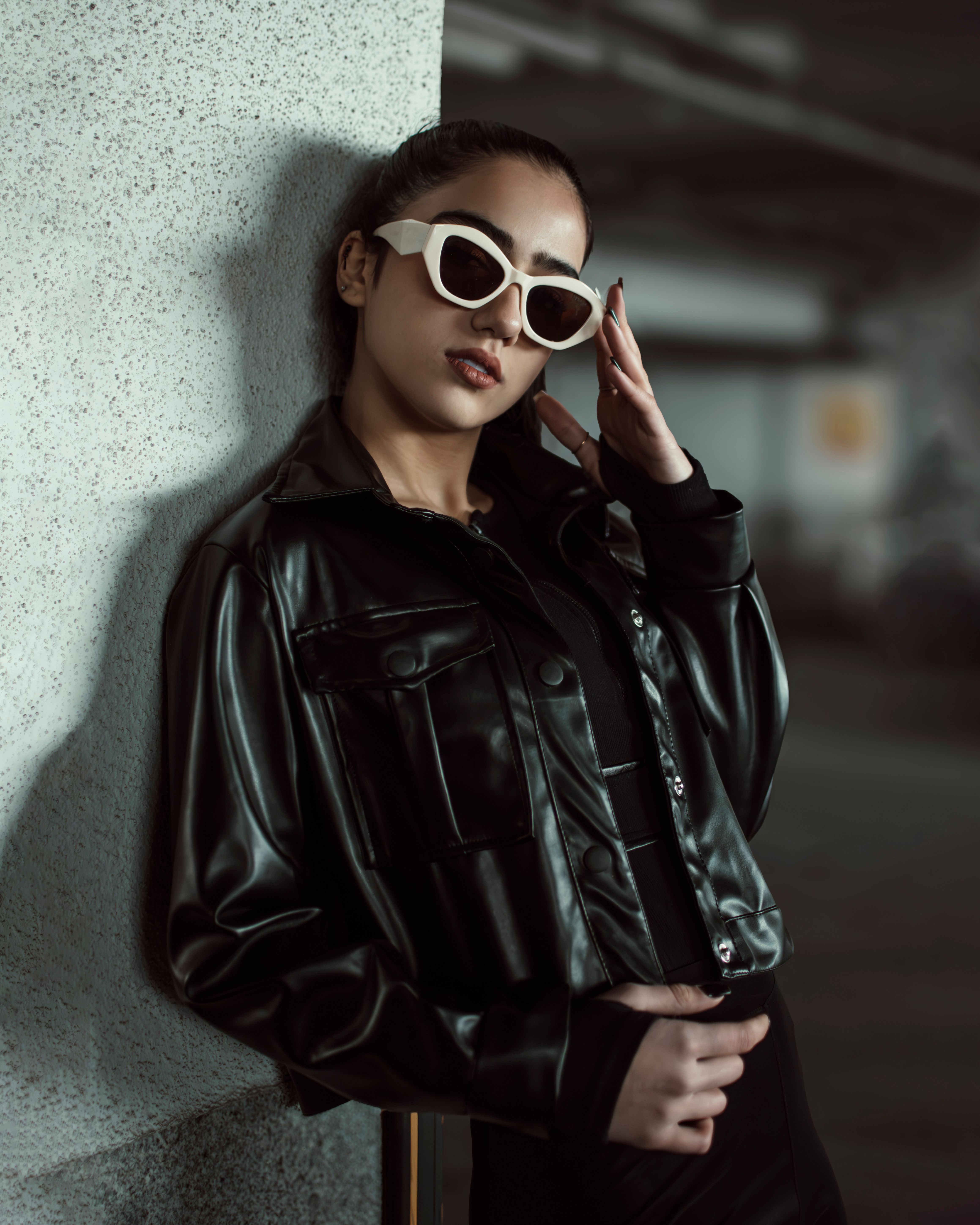 Stylish Woman in Black Leather Jacket with Sunglasses · Free Stock Photo