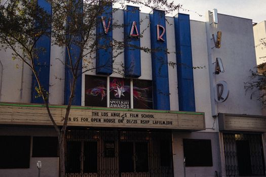 Retro theater facade with film school sign in Los Angeles.