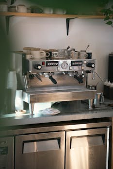 High-quality image of a commercial espresso machine in a cozy cafe, perfect for coffee shop aesthetics.