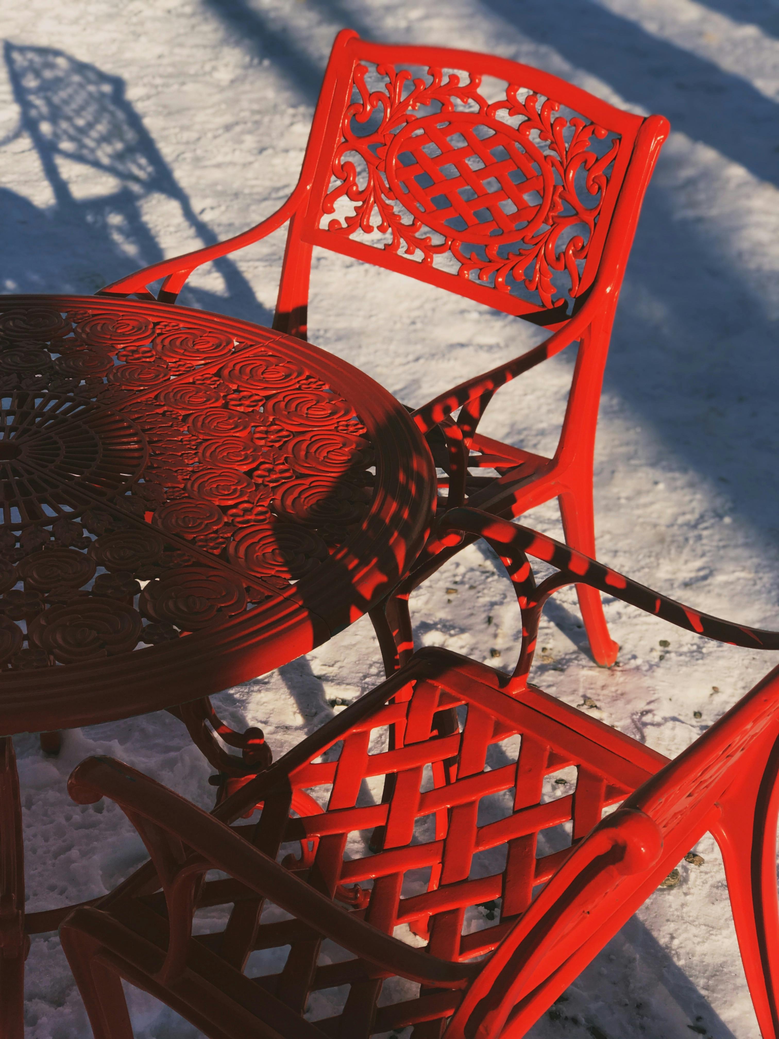 Vibrant Red Outdoor Furniture in Snowy Setting · Free Stock Photo