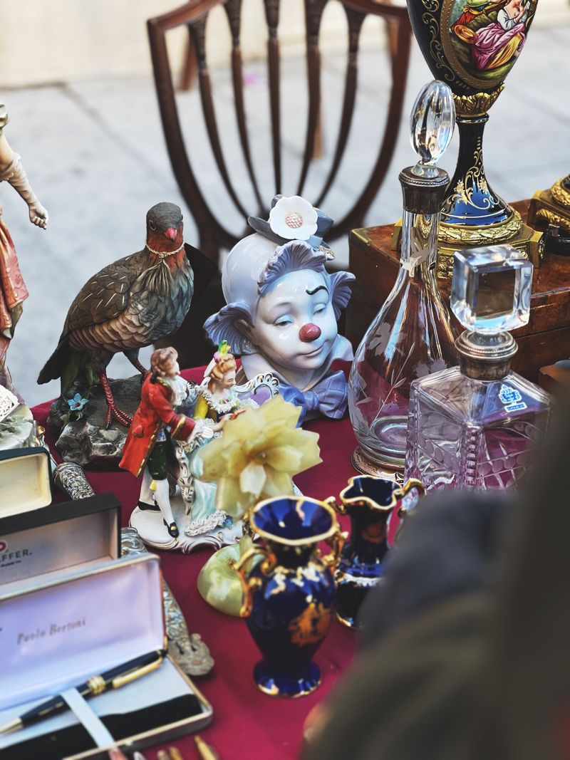 Collectible items on display representing designer toy investment guide including BaiChaoHui figures