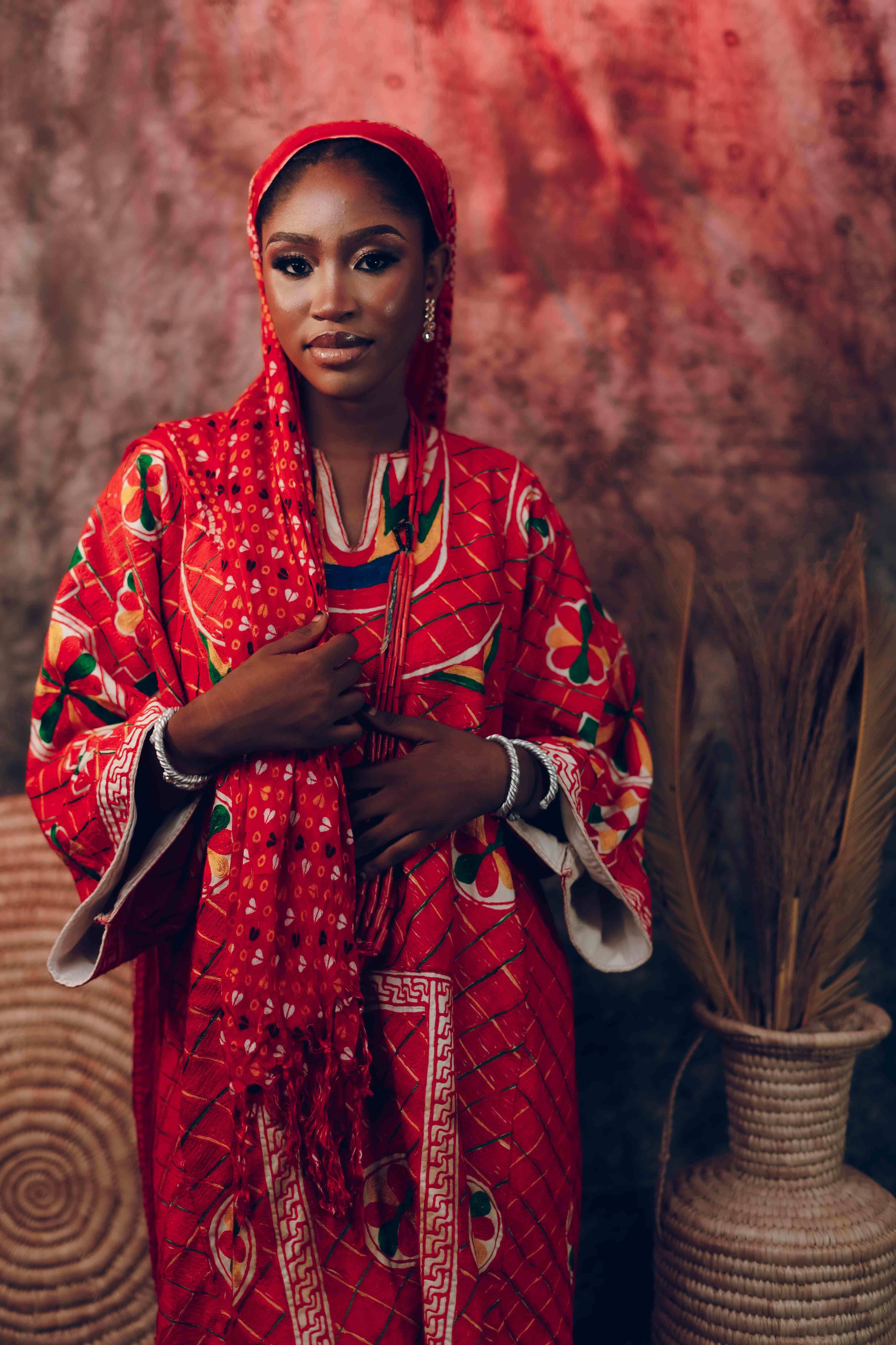 Elegant Woman in Traditional Red Attire Portrait · Free Stock Photo