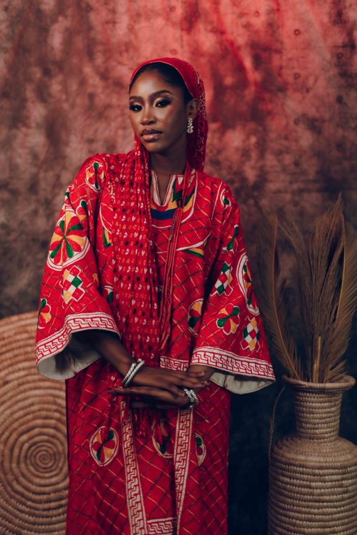 Free Portrait of an elegant woman in colorful traditional clothing with intricate patterns. Stock Photo