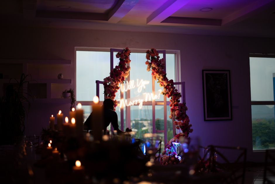 Elegant indoor marriage proposal setting with soft candlelight in Lagos, Nigeria.