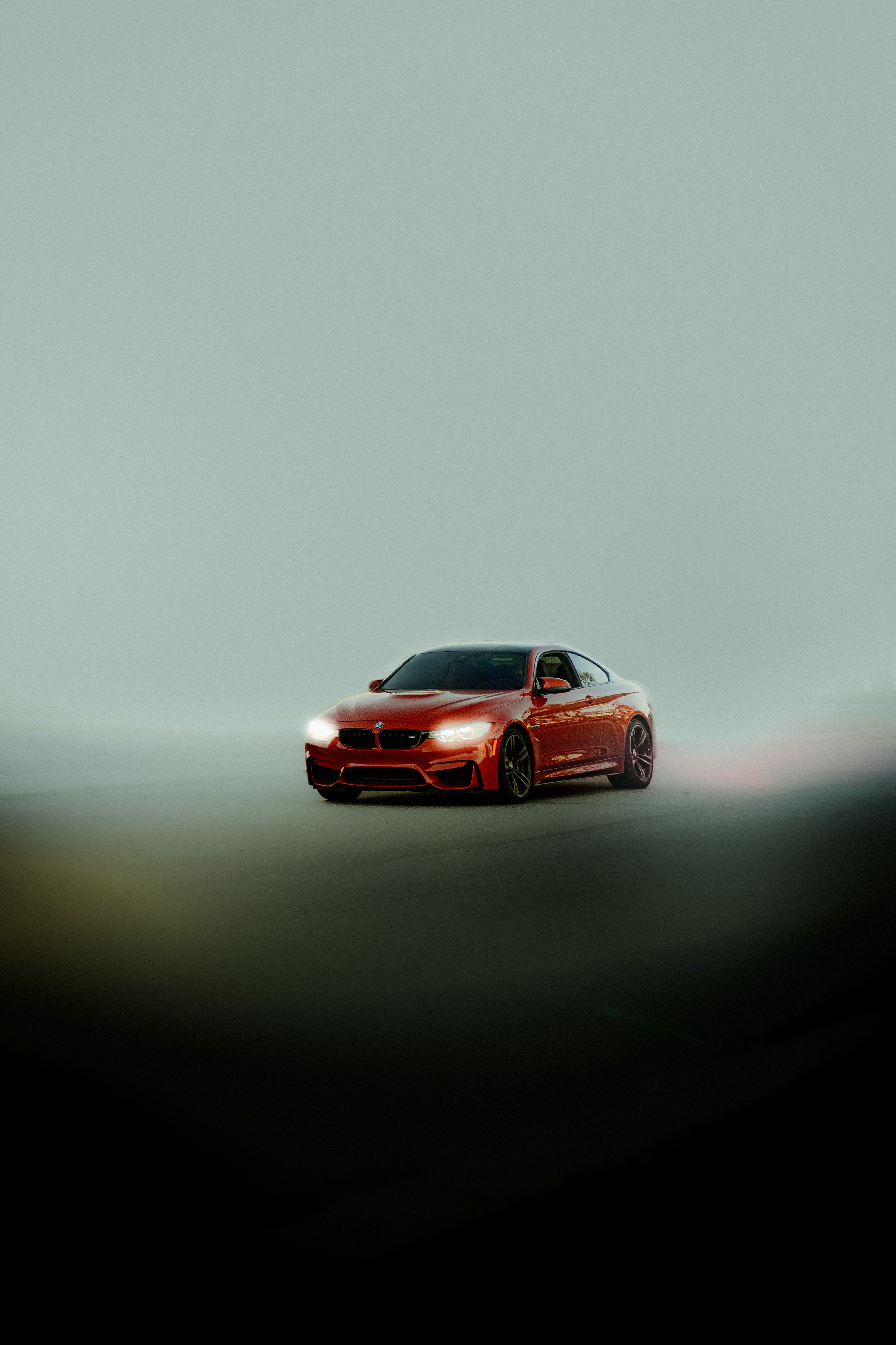 Dynamic Red Sports Car in Foggy Night Drive · Free Stock Photo