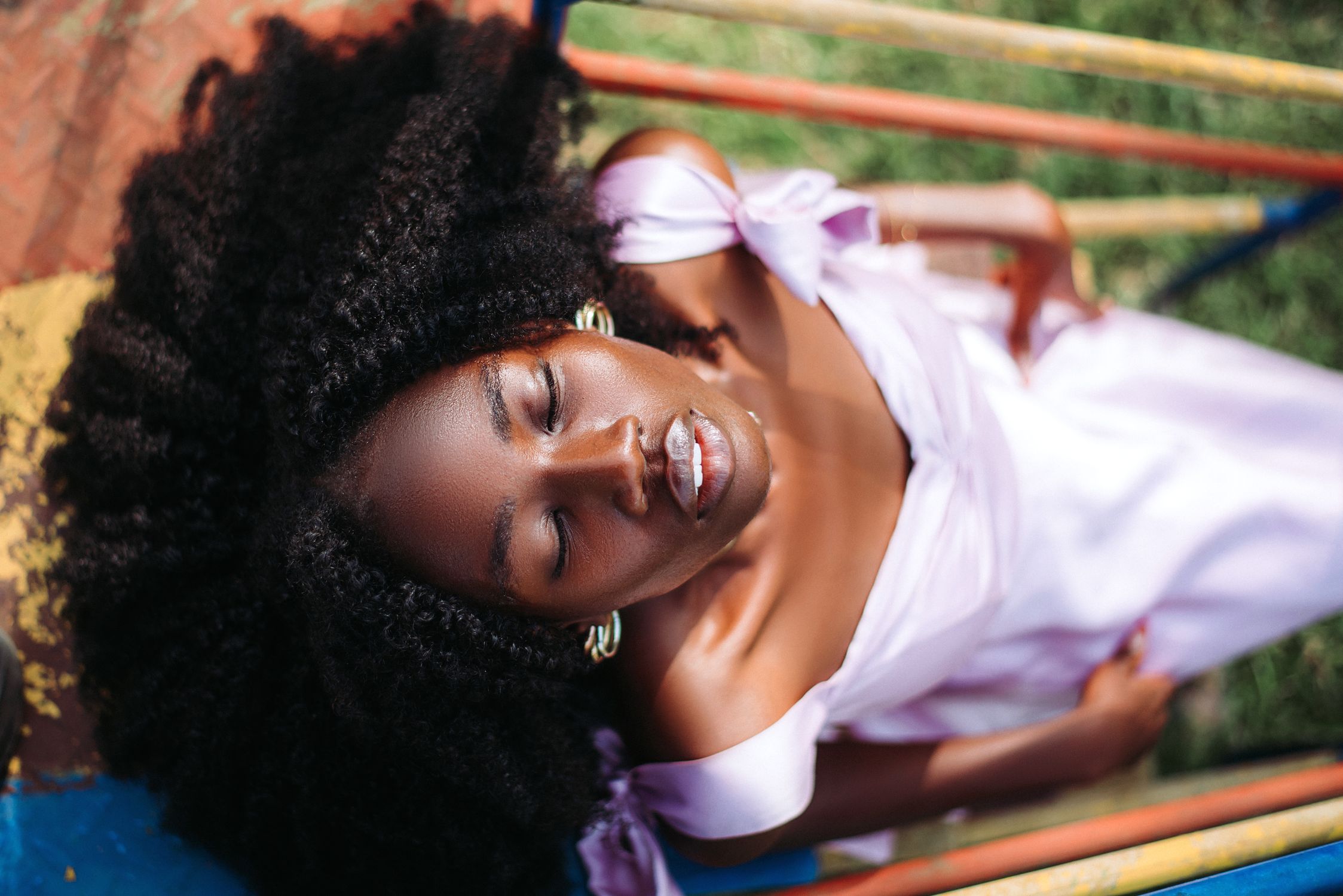 Relaxed Portrait of Woman in Light Purple Dress · Free Stock Photo