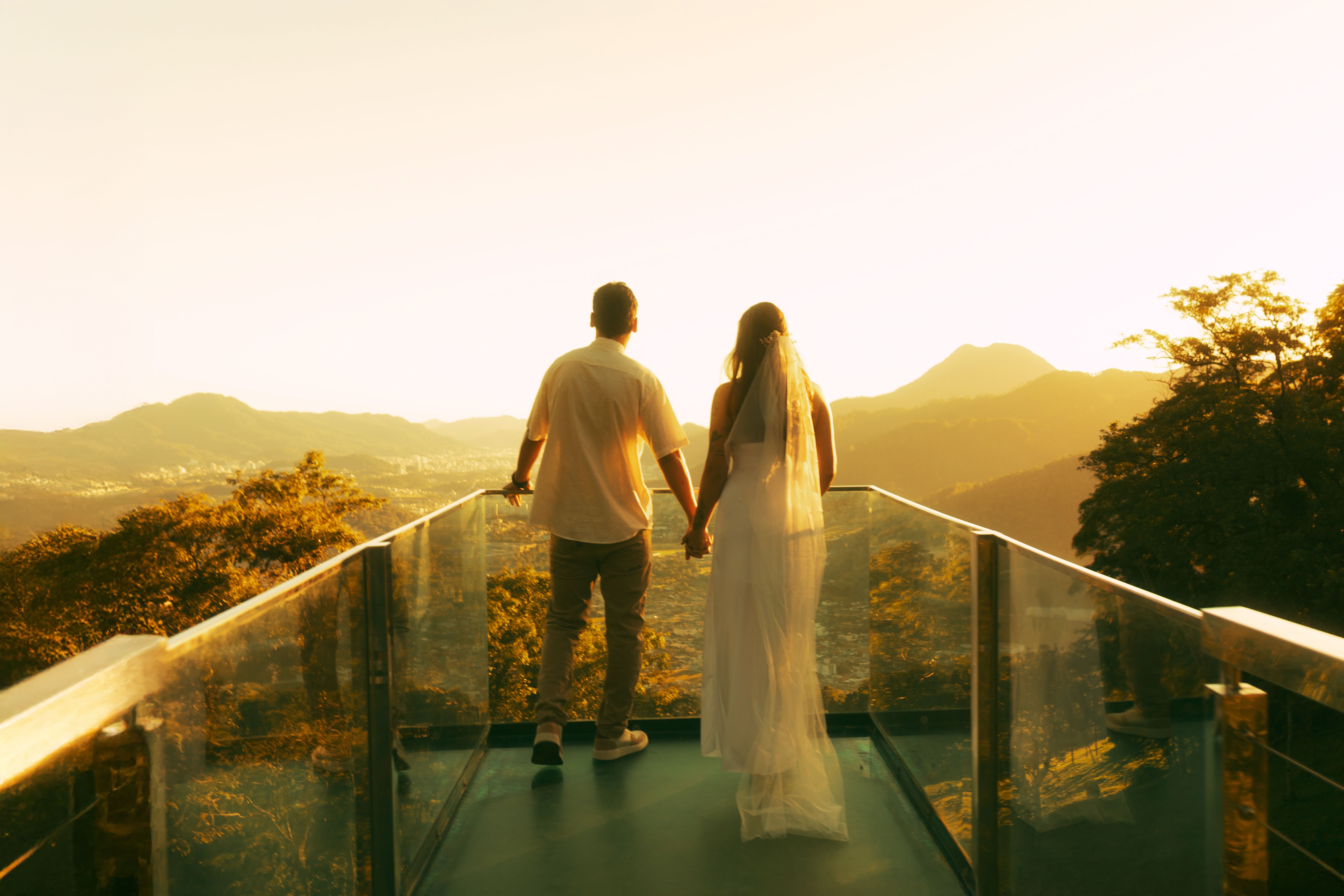Romantic Couple at Scenic Overlook During Sunset · Free Stock Photo