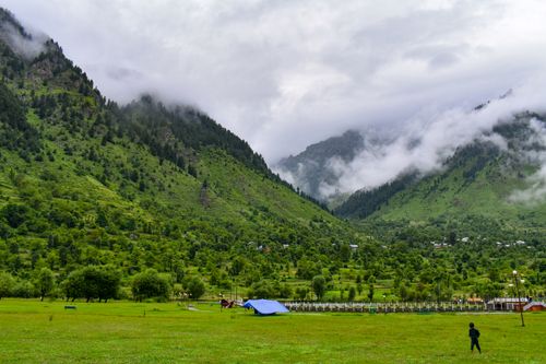 Free Picturesque landscape of misty green mountains in Kashmir during summer. Stock Photo