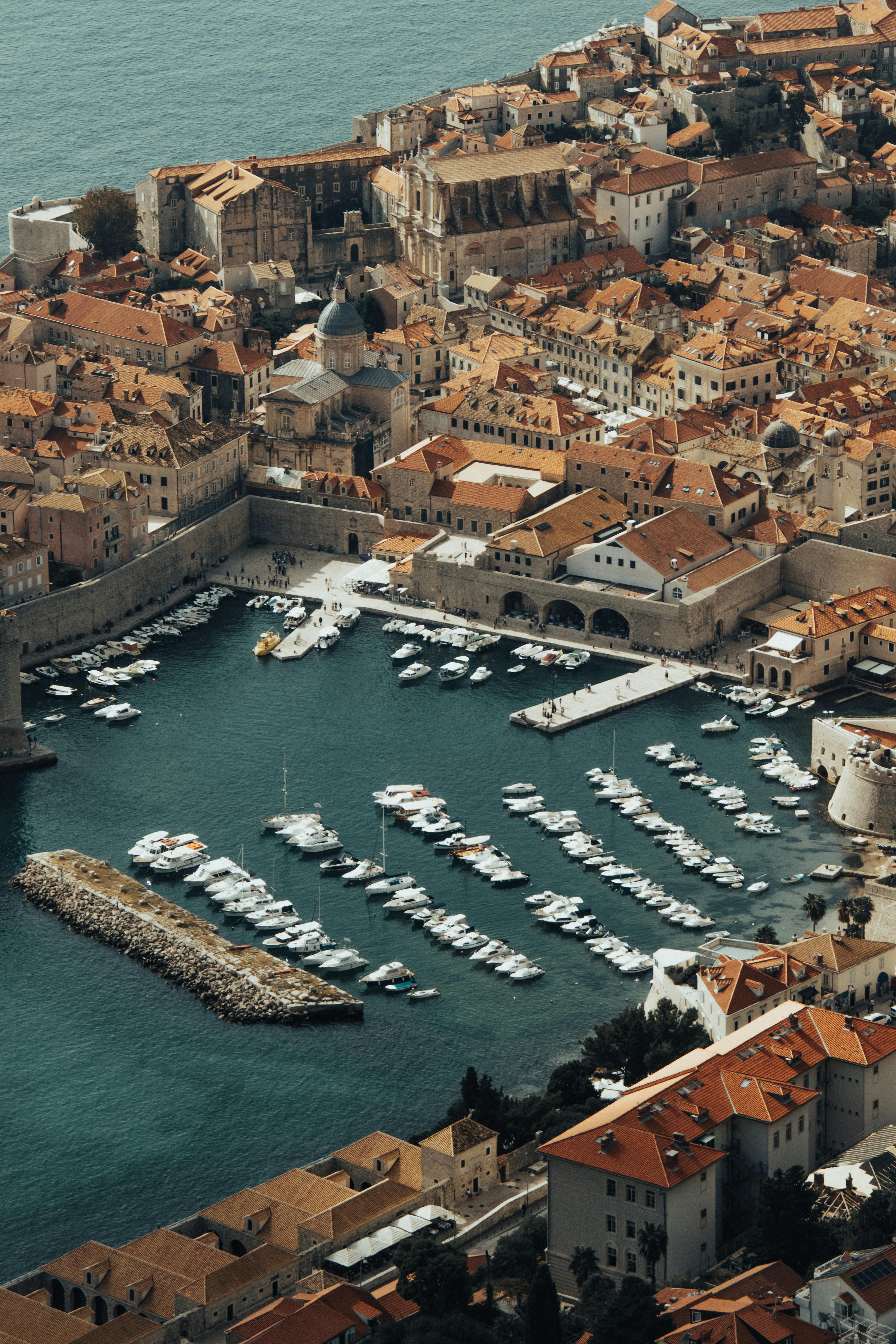 Explore the stunning coastline and historic architecture of Dubrovnik's Old Town from above.
